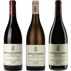 Trois bouteilles de vin du domaine des Comtes Lafon : Volnay-Santenots, Meursault-Perrières et Monthelie-Les Duresses.