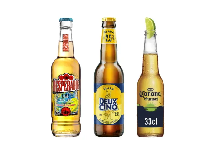 Trois bouteilles de bière : Desperados Lime, Clara Deux Cinq et Corona Sunset. La Desperados a un twist bière citron.