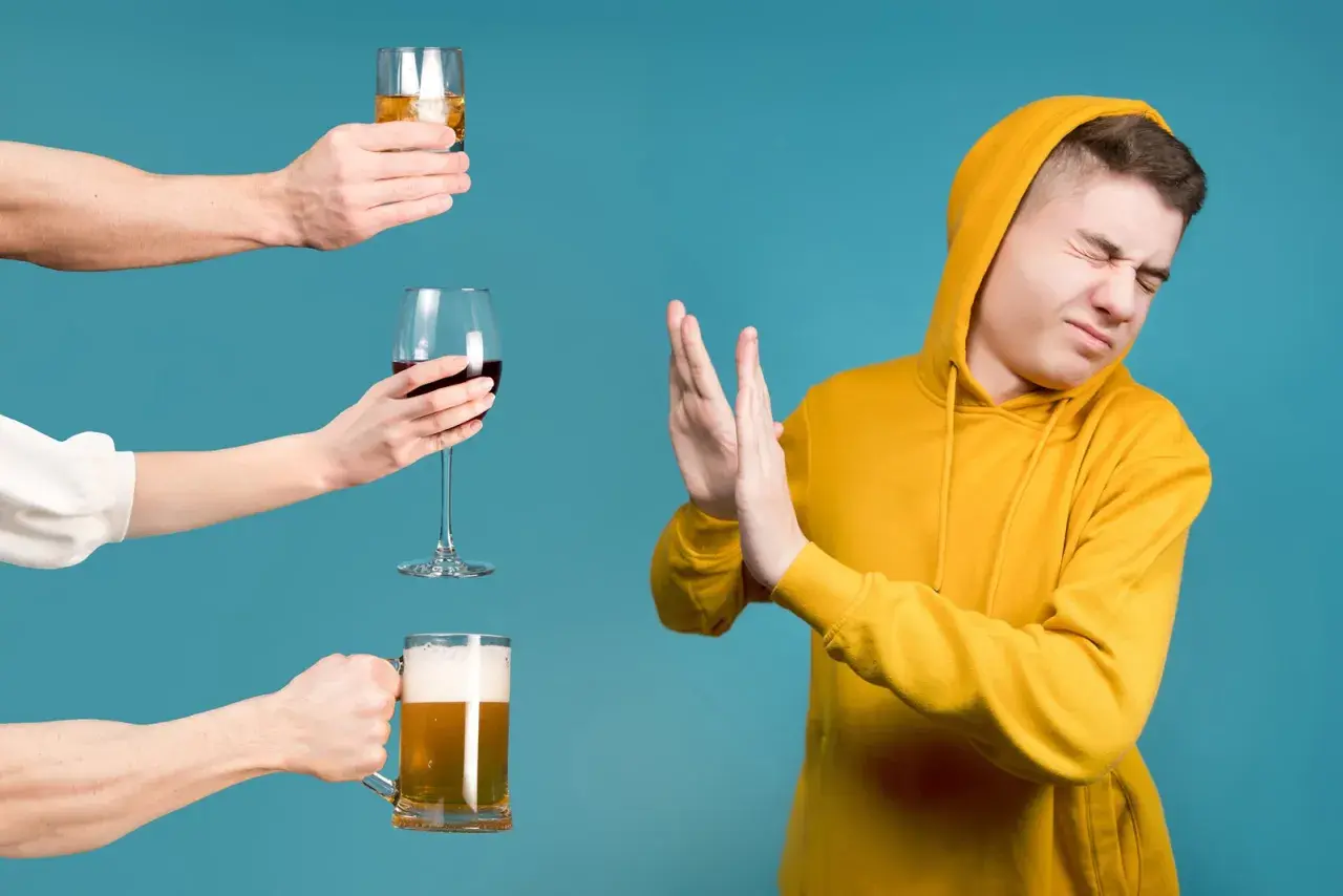Un jeune homme refuse des boissons alcoolisées, y compris une bière et du vin, qui sont tous des alcools moins de 18 degrés.